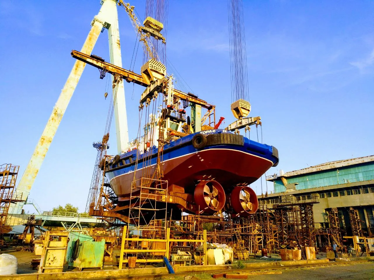Marine Service technicians working on a vessel hull